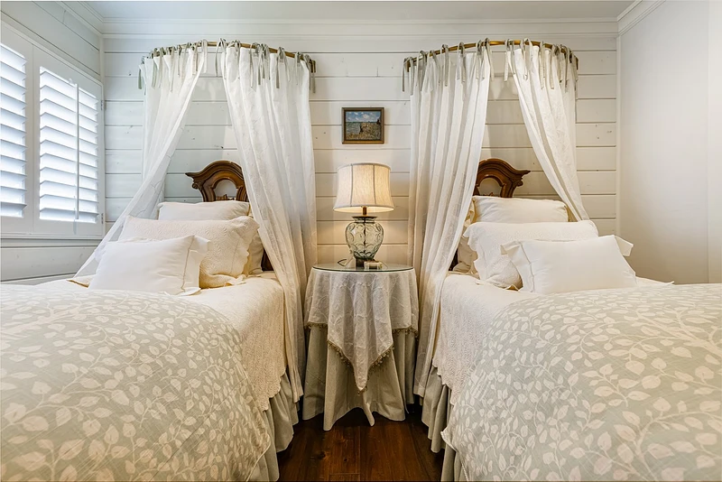 Sister’s Twin Canopy Antique Bedroom