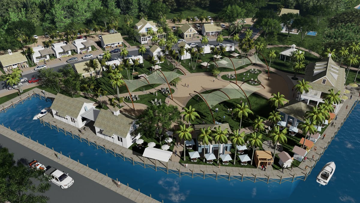 Aerial view of waterfront community with buildings, palm trees, dock, seating areas, and sandy recreational spaces.