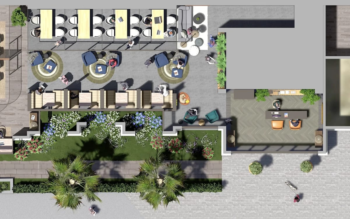 Patio with yellow tables, seating on rugs, flower garden, palm trees, and stone pathways to a covered area