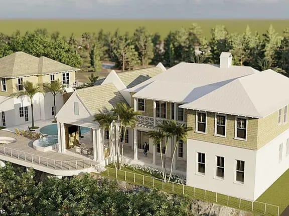 Two-story house with beige siding, gabled roofs, front porch, and pool area.