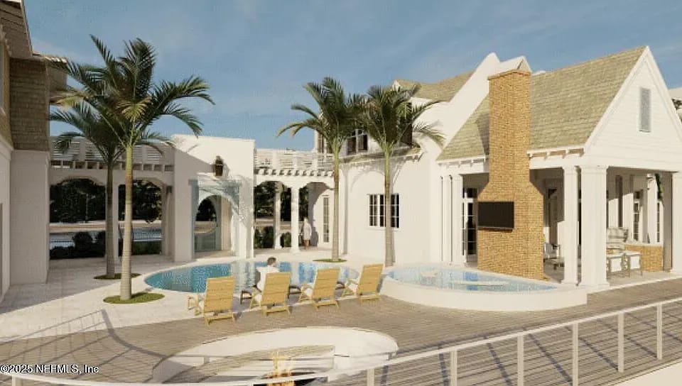 Exterior rear with pool area, lounge chairs, palm trees, and a covered patio.