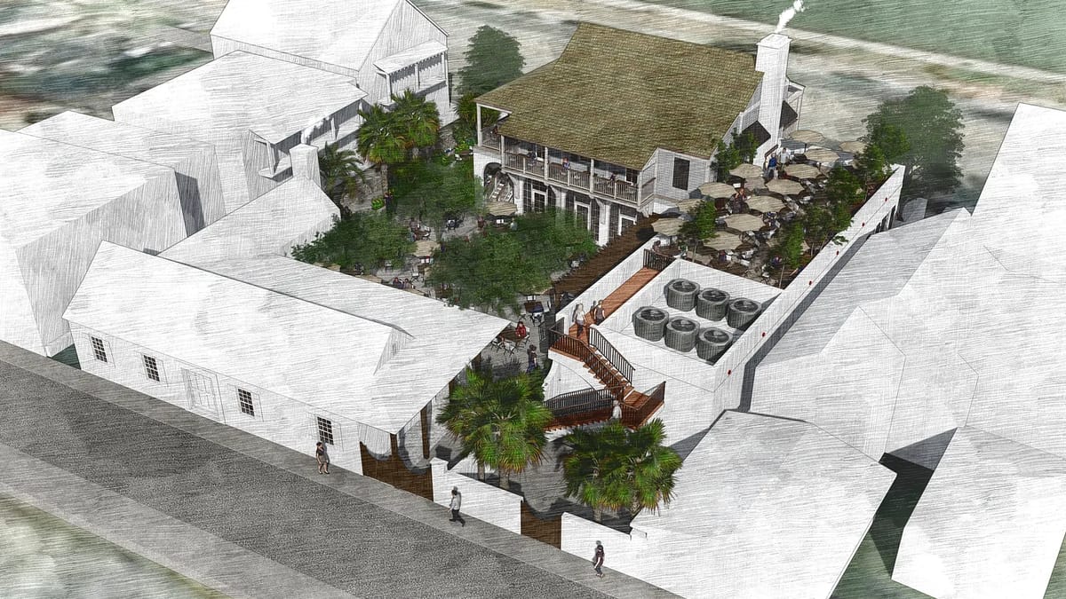 Aerial view of a property with structures, terrace, outdoor seating, trees, and pathways.