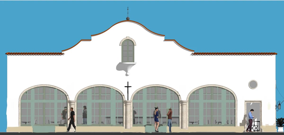 Exterior front elevation of a white stucco building with arched windows and a central cross.