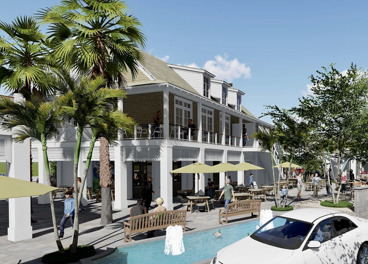 Exterior front with two-story building, balcony, palm trees, benches, tables, umbrellas, and a water feature