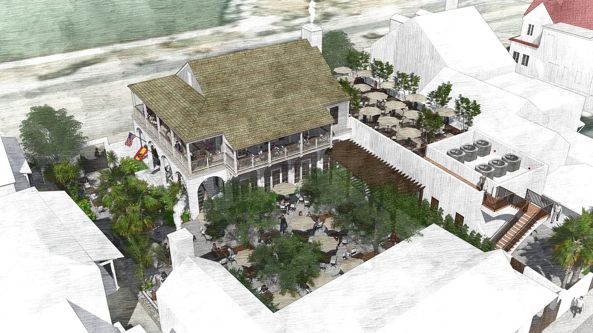 Outdoor gathering space with a building, seating areas, palm trees, and steps leading to a raised platform.