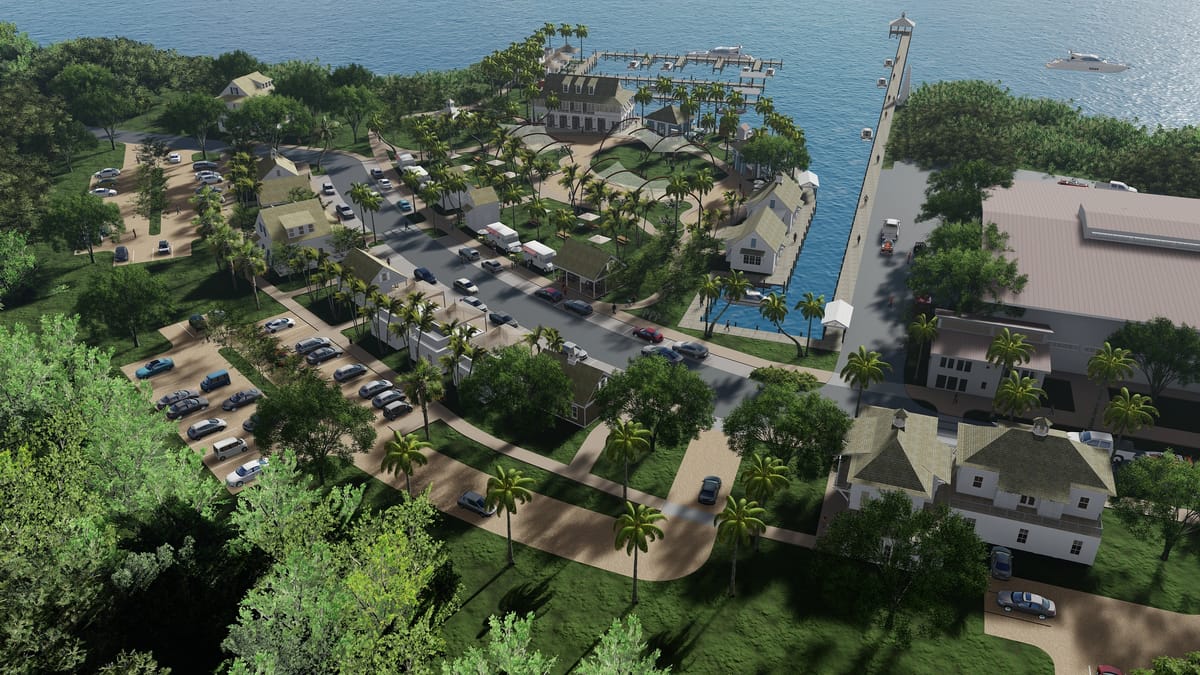 Aerial view of a coastal development with buildings, roads, palm trees, and a marina.