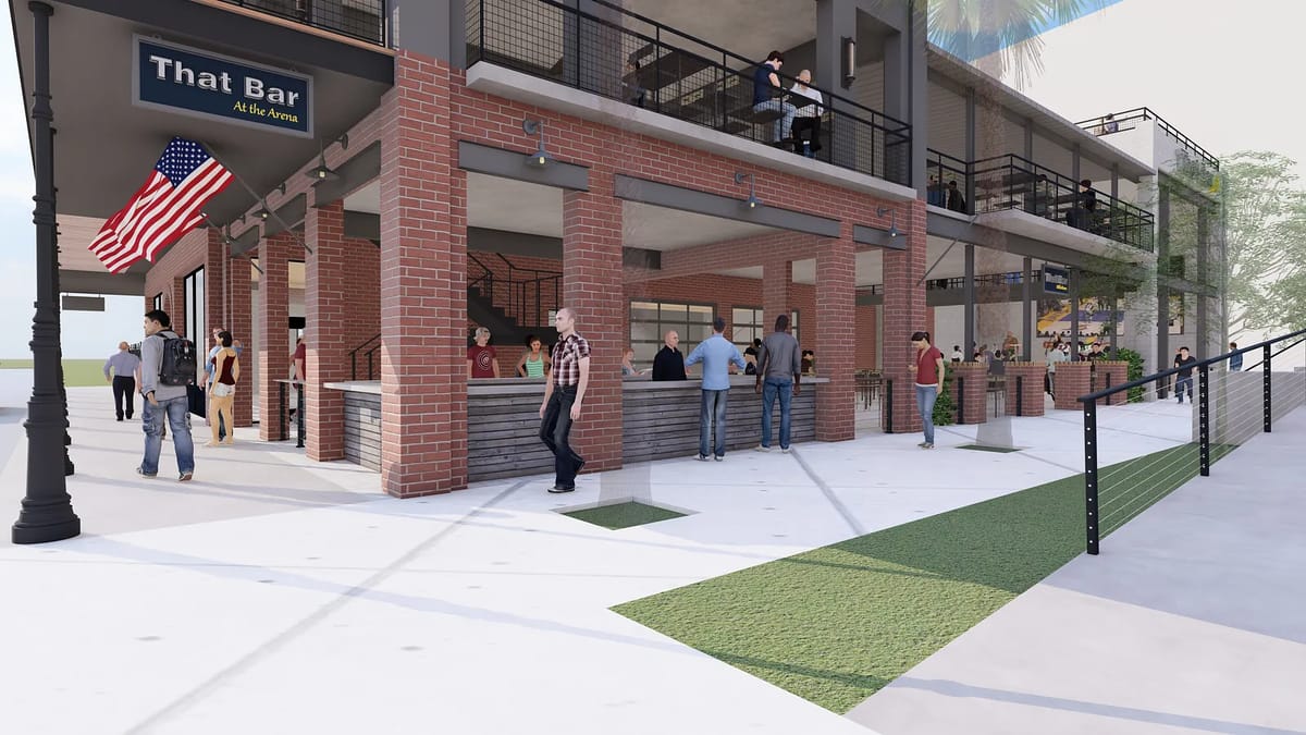 Exterior front of a bar with brick facade, outdoor seating, sign, and American flag.