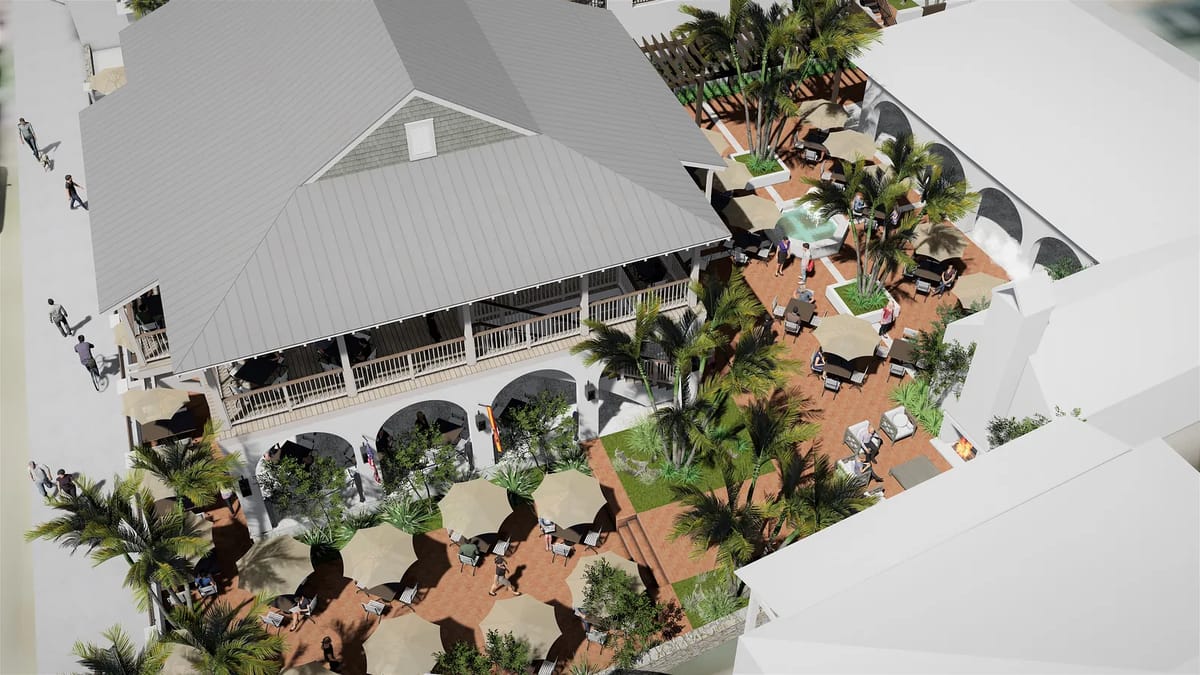 Outdoor patio with tables, chairs, umbrellas, lounge chairs, and potted palms, surrounded by landscaping.