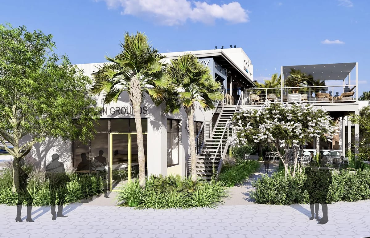Exterior view of a modern two-story building with stairs, balcony, palm trees, and hexagonal stone paving.
