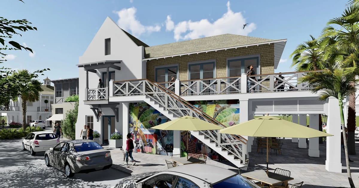 Exterior view of a two-story building with staircase, balcony, outdoor seating, and nearby vehicles.