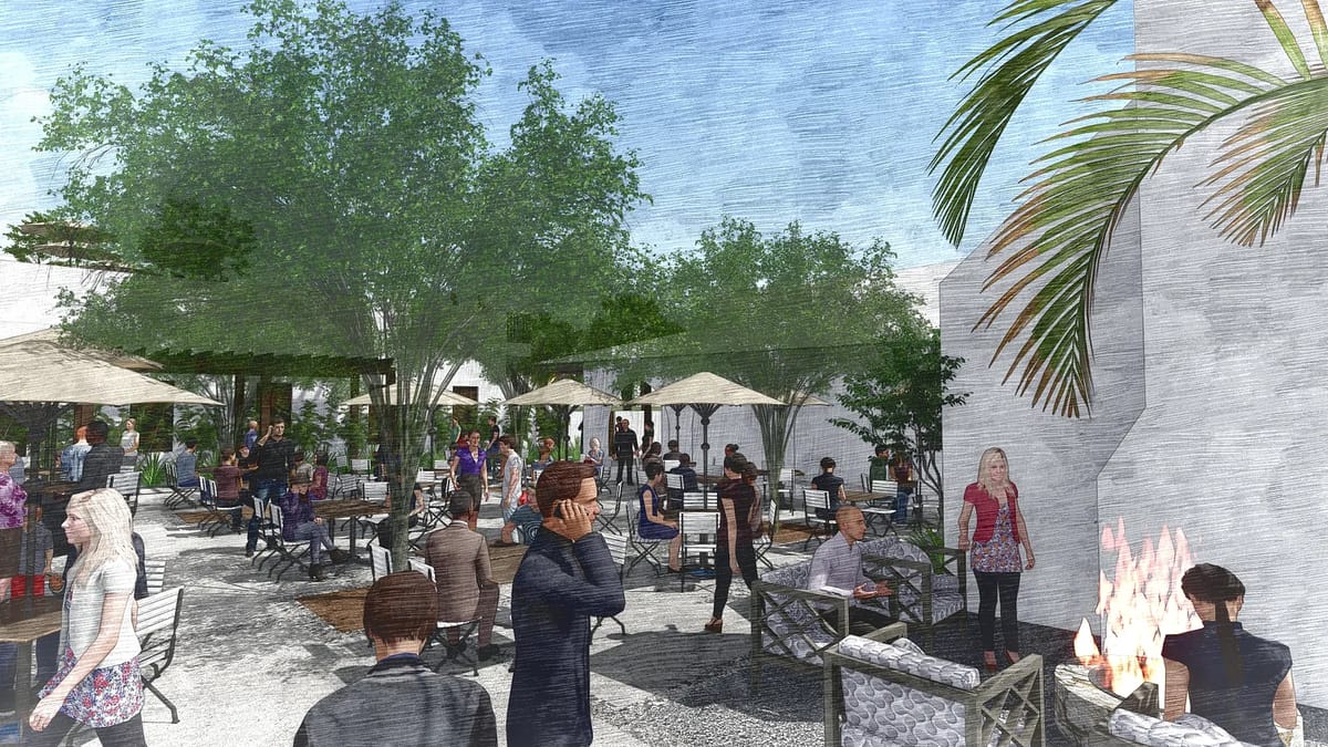 Outdoor patio with tables, chairs, umbrellas, potted plants, groups of people, and a fire feature.