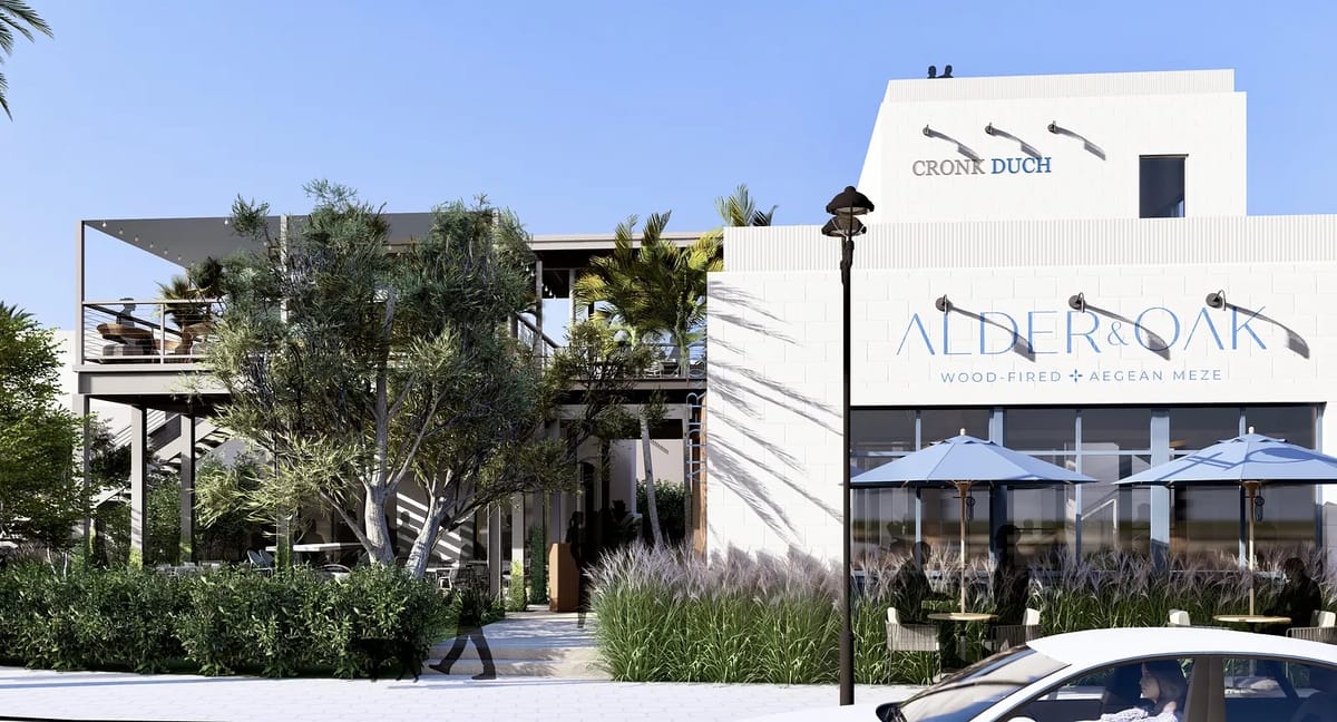 Exterior view of a two-story restaurant with outdoor seating, large windows, and landscaped areas.