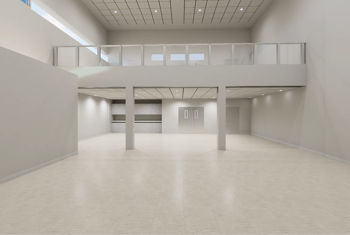 Open space with white walls, light flooring, second-floor balcony, and recessed lighting.