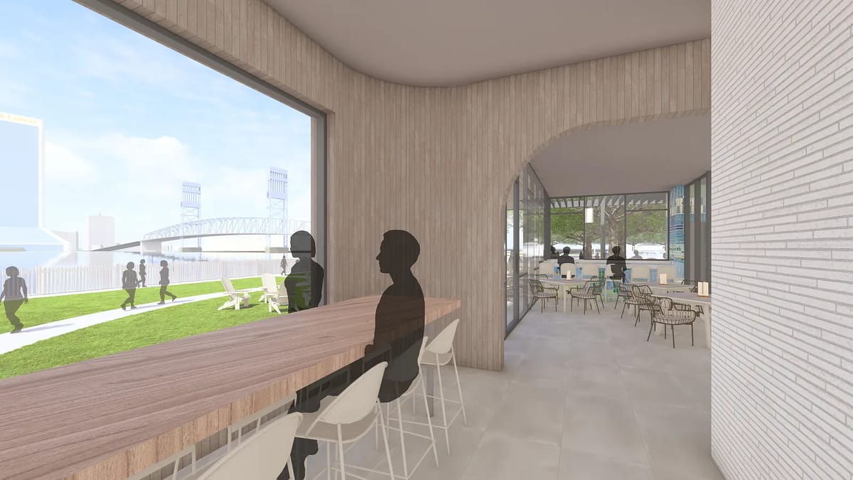 Interior space with large windows, wood counter, high stools, tiled floor, and outdoor views.