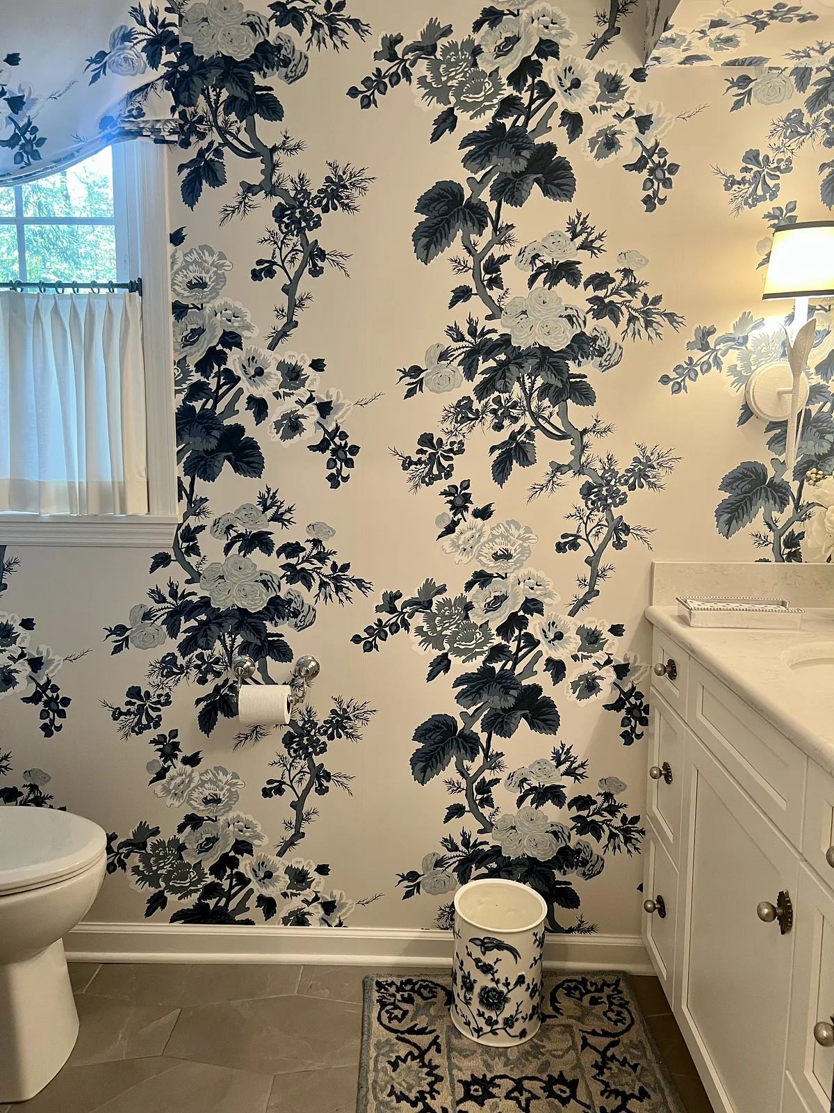 Layered , intentional and feminine Powder room design