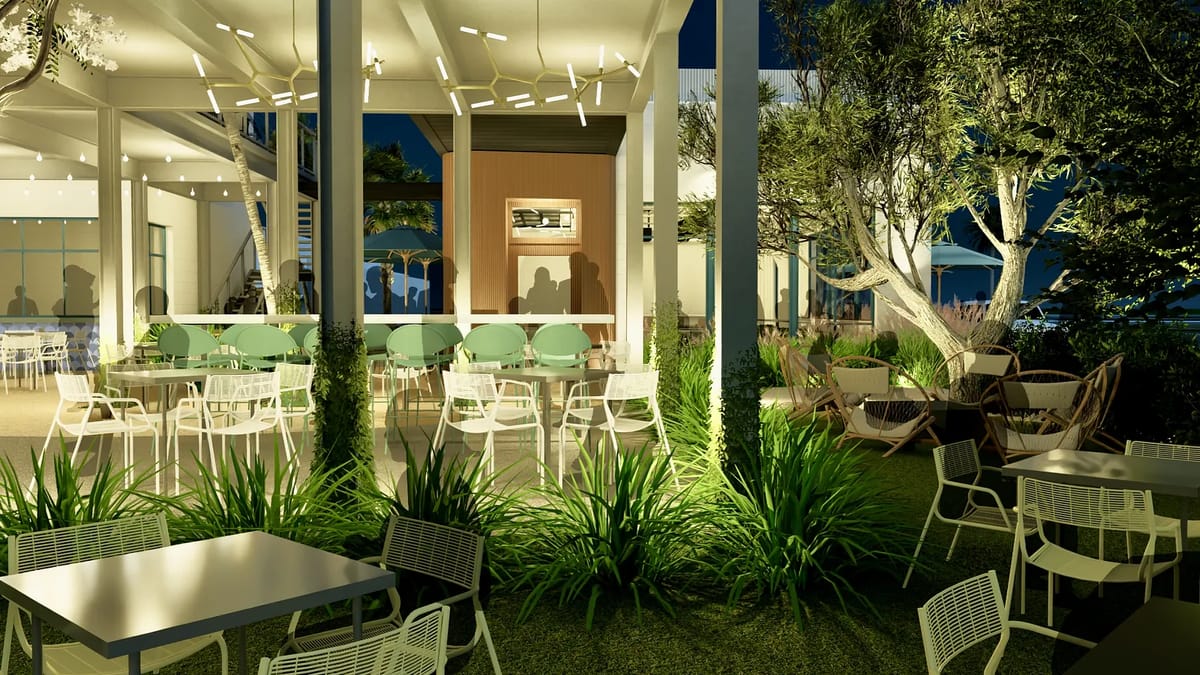 Outdoor patio with green chairs, white tables, potted plants, and shaded seating areas.