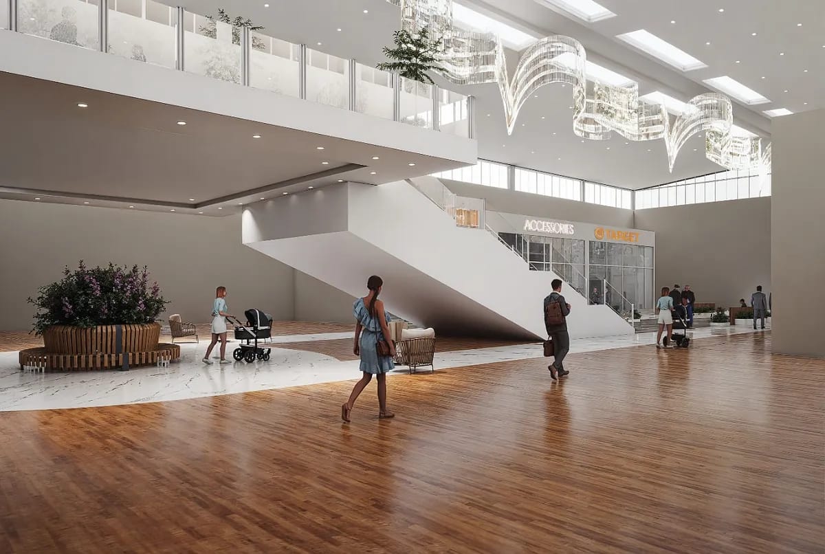 Open commercial space with wooden floor, seating, staircase, and large windows with signs for 'ACCESSORIES' and 'TARGET'.