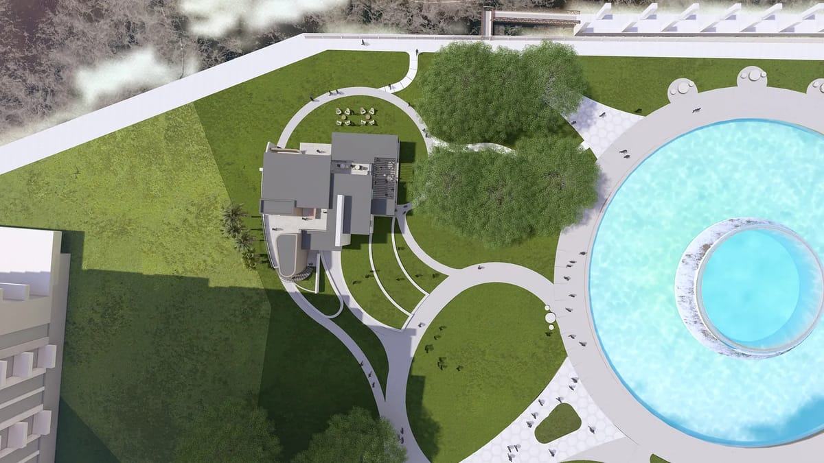 Aerial view of landscaped area with swimming pool, pathways, and greenery surrounding a modern building.
