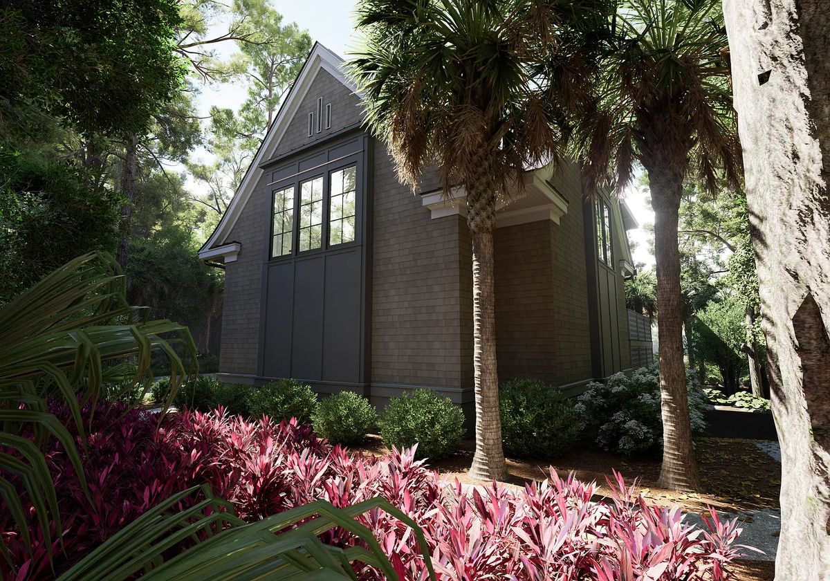 Exterior front of a house with gray siding, gable roof, large windows, and lush landscaping.