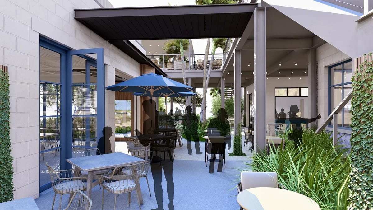Patio with round tables, wicker chairs, umbrella, potted plants, and people engaging in conversation.