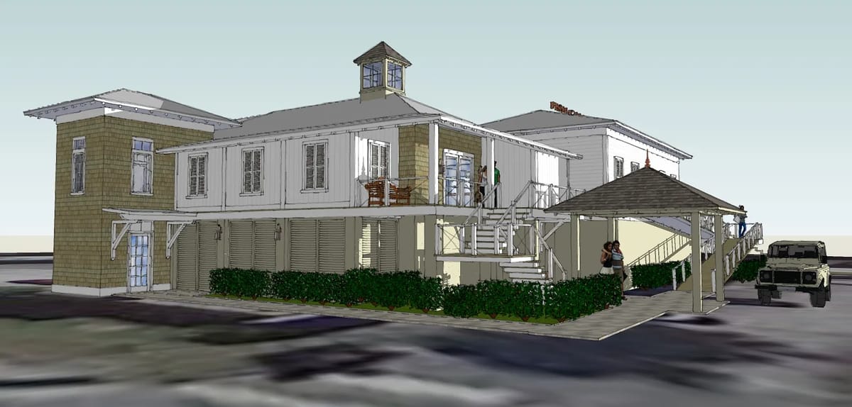 Front exterior of a two-story house with gabled roof, cupola, covered porch, and shrubs