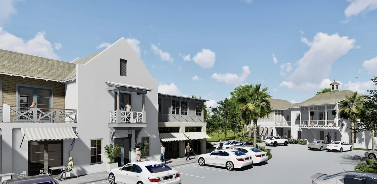 Exterior front view of building complex with two structures, parking, and landscaping including palm trees.