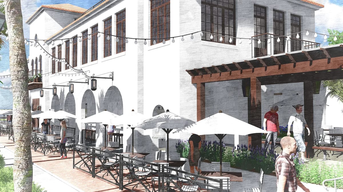 Exterior front area with a building, outdoor seating, umbrellas, string lights, and paved brick ground