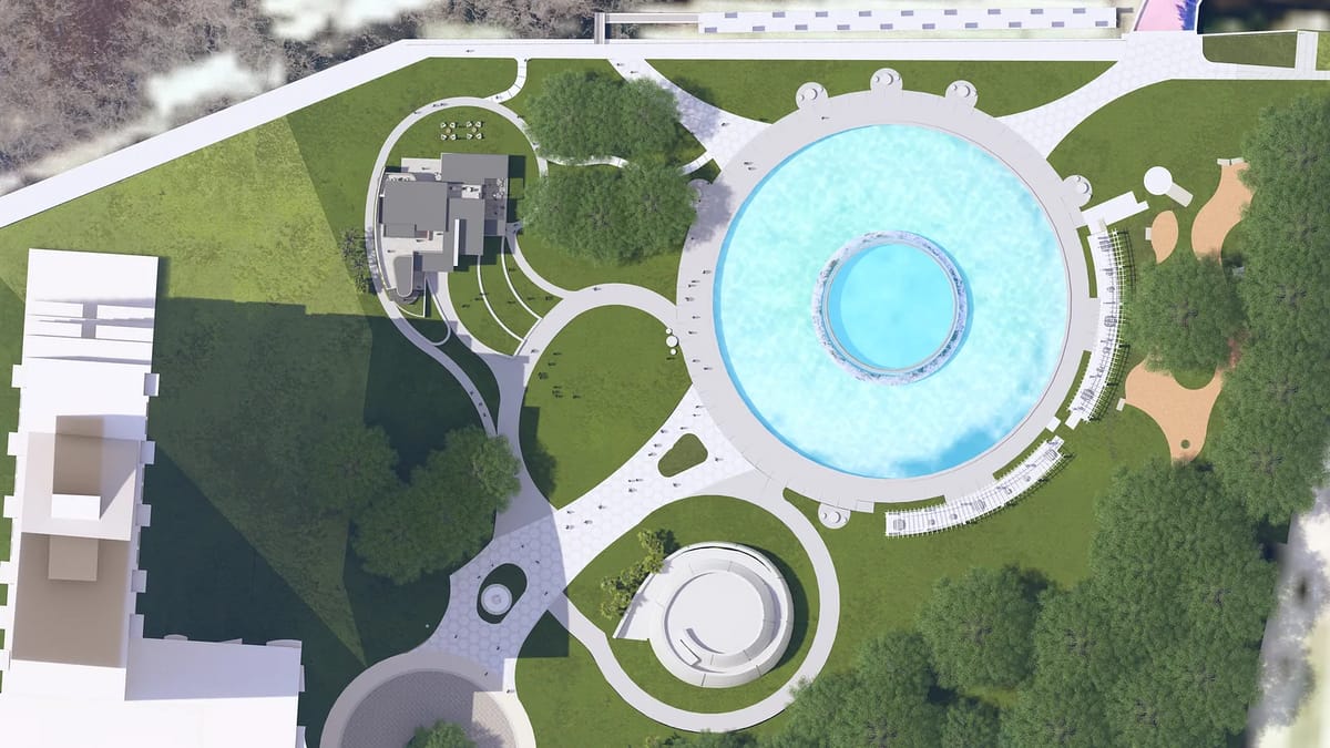 Aerial view of outdoor space with circular pool, green lawns, pathways, and seating areas.