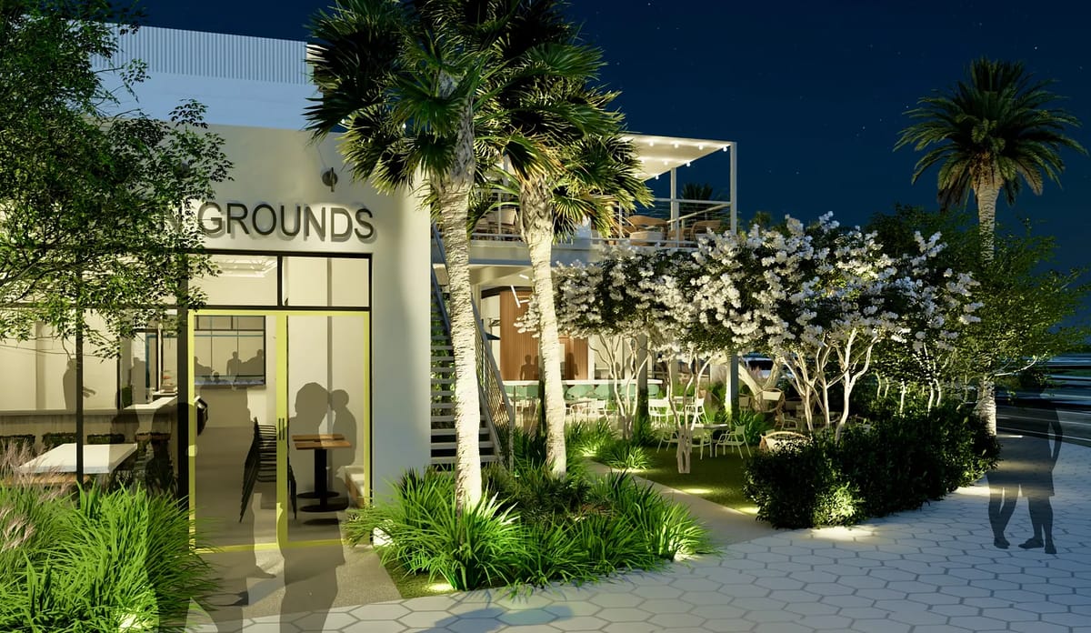 Exterior area with a modern building, landscaping, outdoor seating, and decorative lighting.