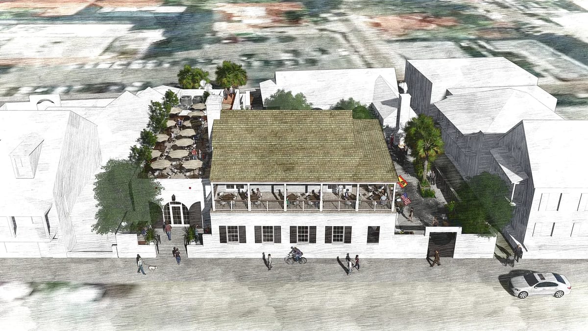 Exterior view of a building with terrace, palm trees, large windows, and urban surroundings.