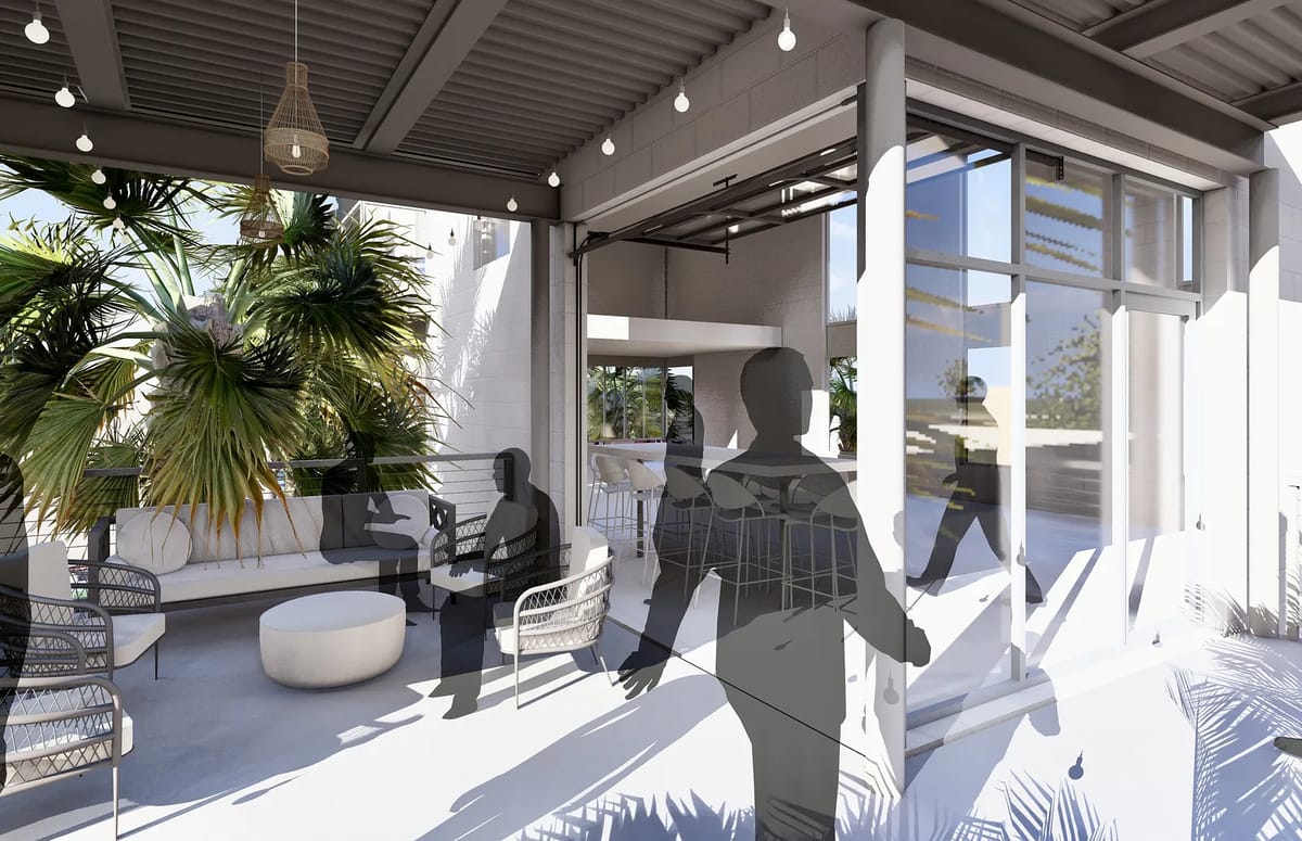 Deck area with circular table, chairs, tropical plants, and large sliding glass doors.