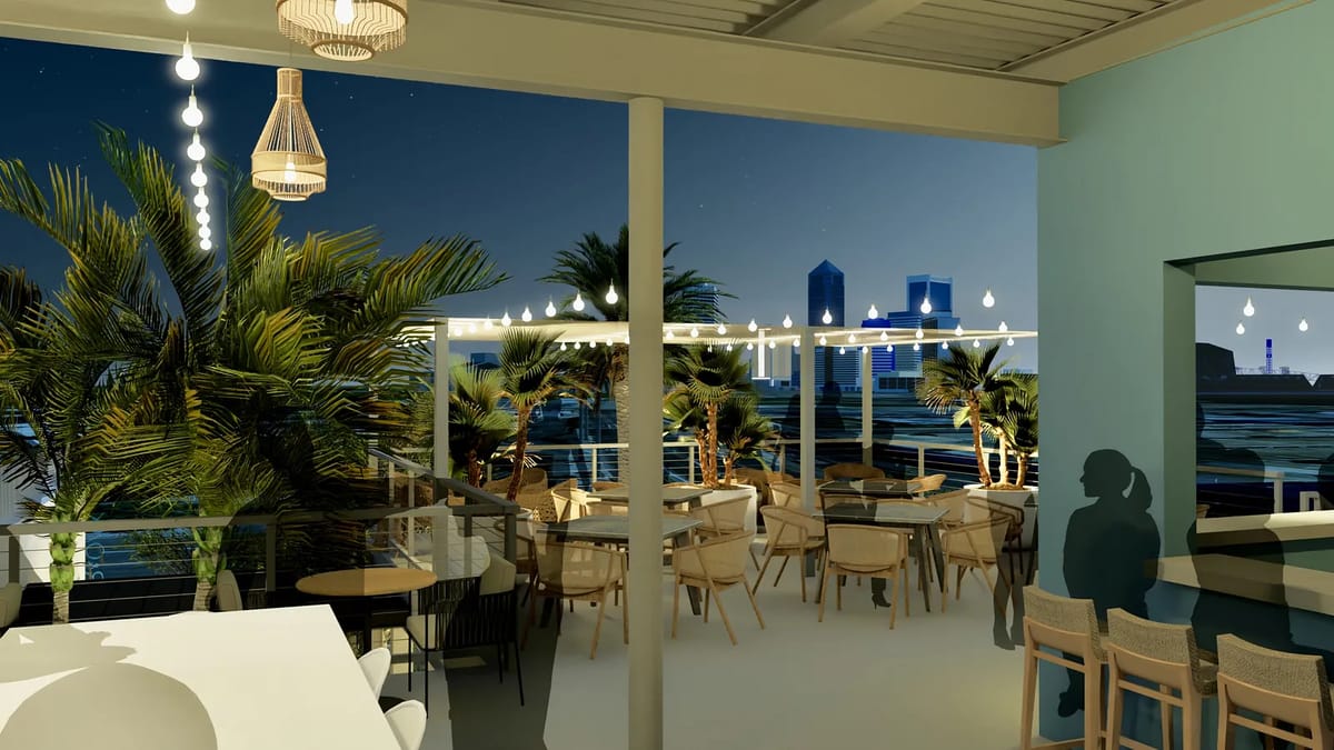 Deck with circular tables, chairs, bar counter, palm plants, and skyline view.