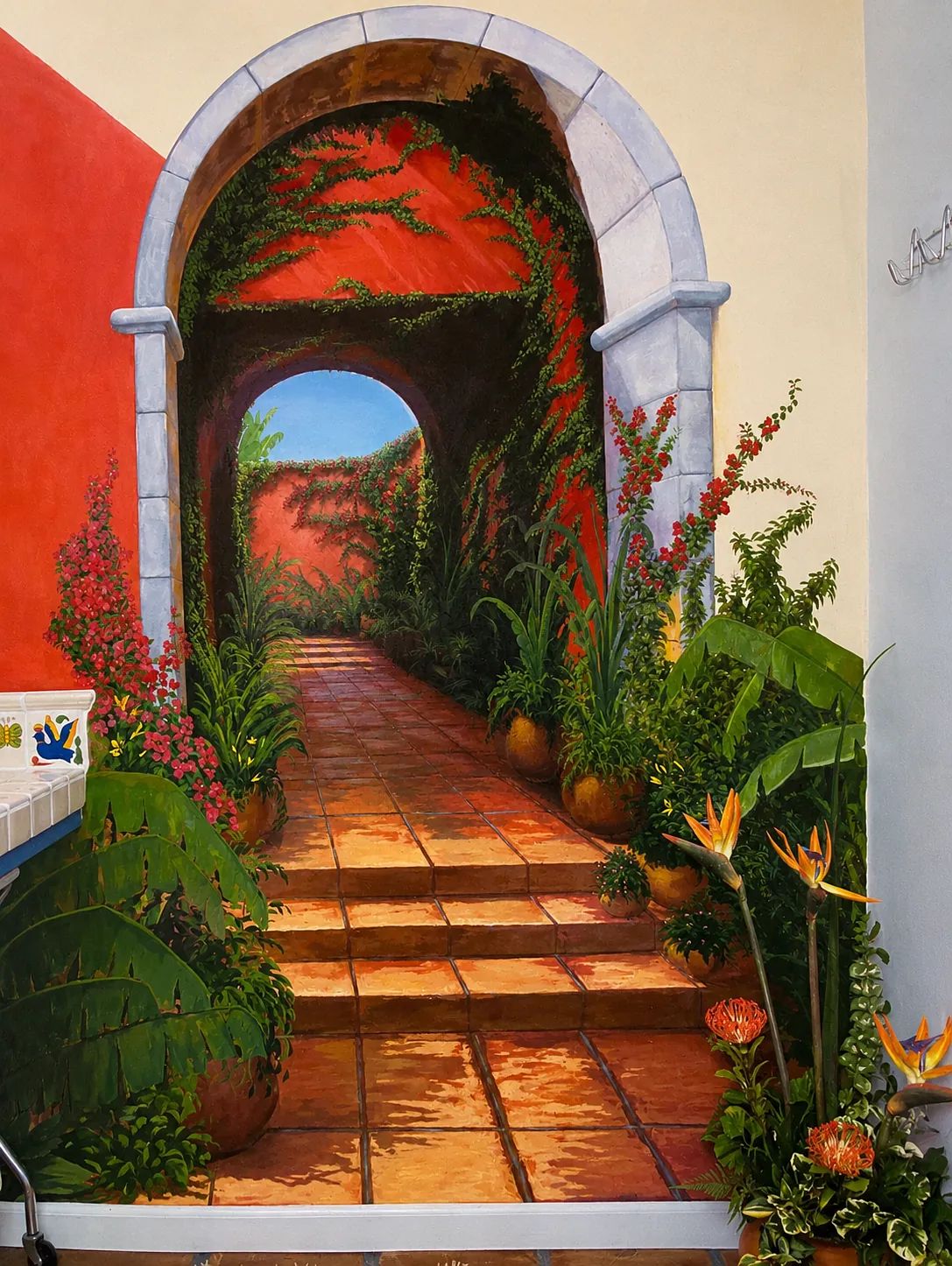 Mural of a pathway with greenery, flowers, terracotta tiles, and an arched stone entrance.