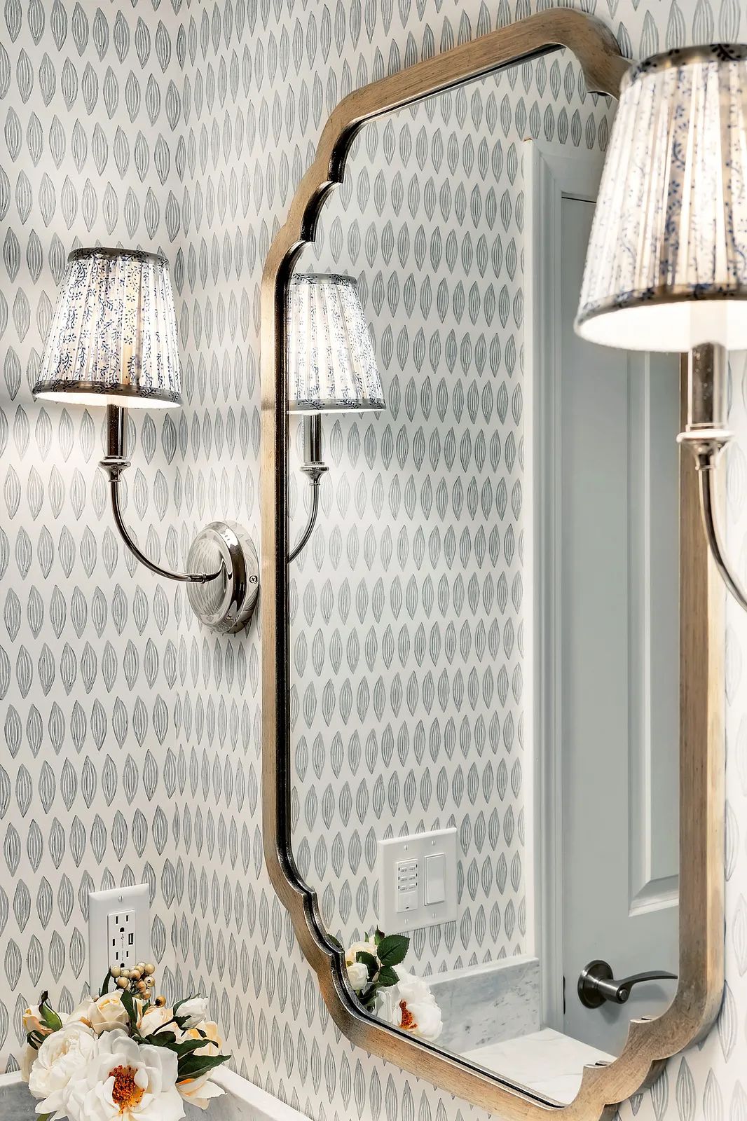 Feminine flourishes for a remodeled powder room