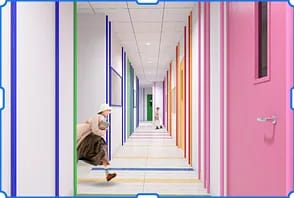 Hallway with colorful doors, white walls, and striped floor pattern with seated figures.
