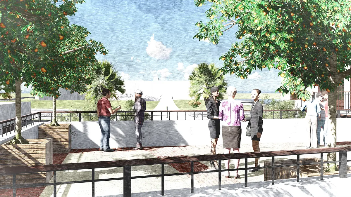 Patio with wooden deck, railing, seating areas, trees, and open landscape view with people conversing.