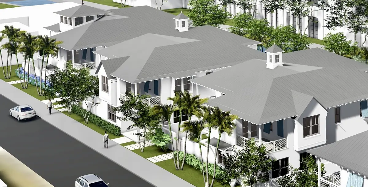 Exterior view of residential buildings with gray roofs, palm trees, and landscaped pathways.