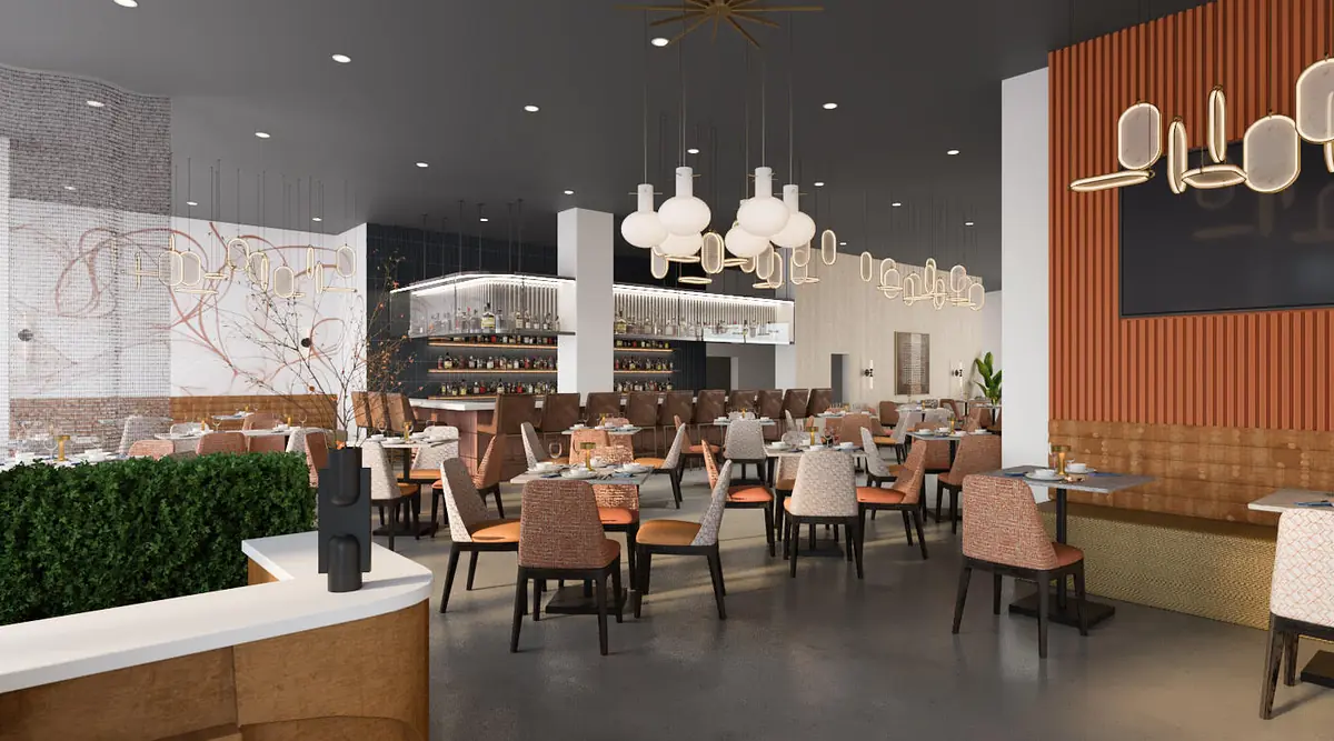 Dining room with multiple tables, chairs in orange and brown, wall panels, and bar area with pendant lights.