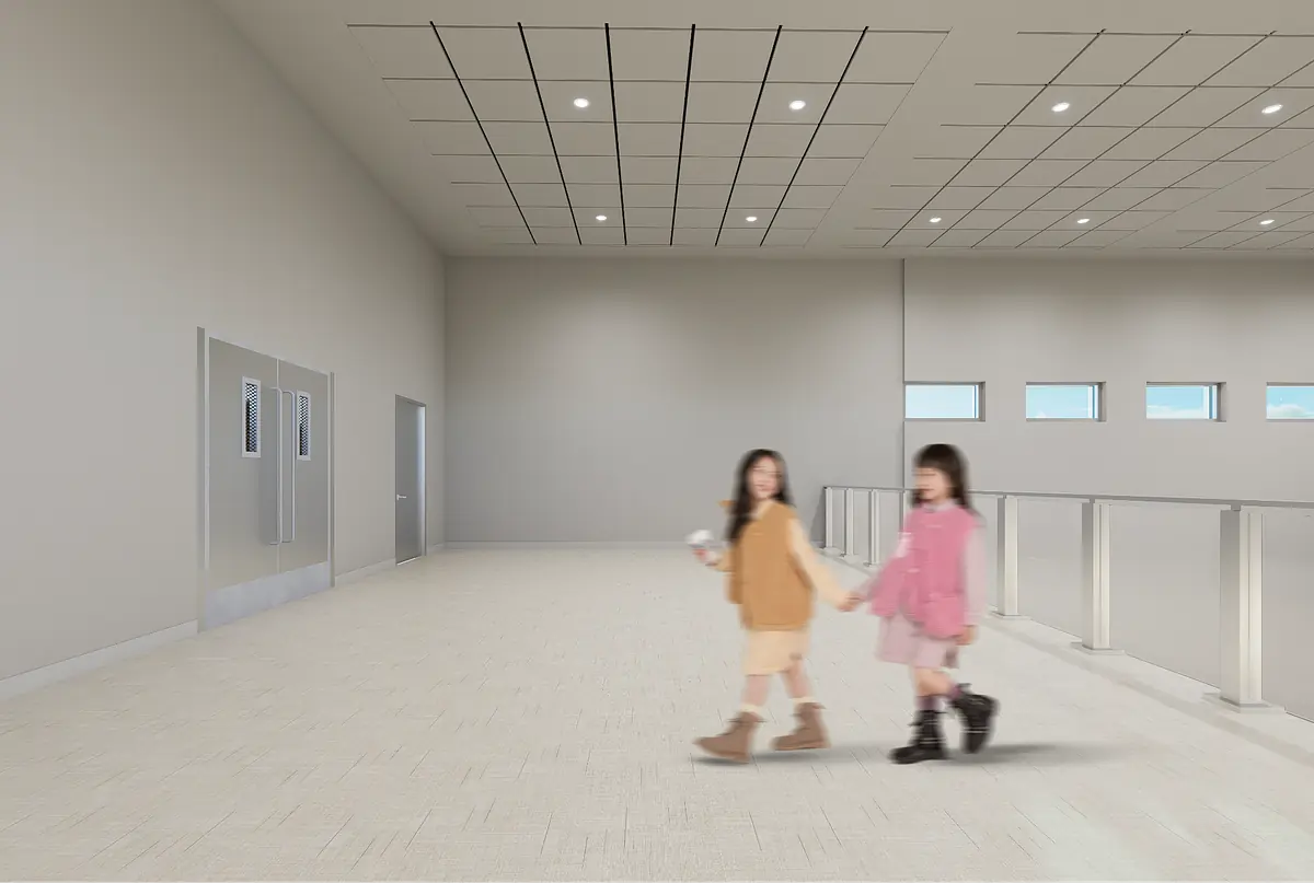 Hallway with light walls, textured floor, two doors, small windows, and recessed lights.