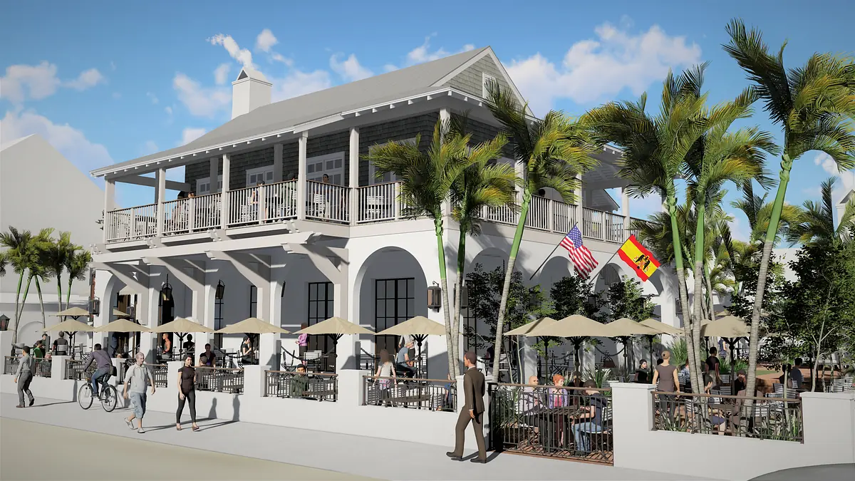 Front exterior with two-story structure, balconies, palm trees, outdoor seating, and displayed flags.