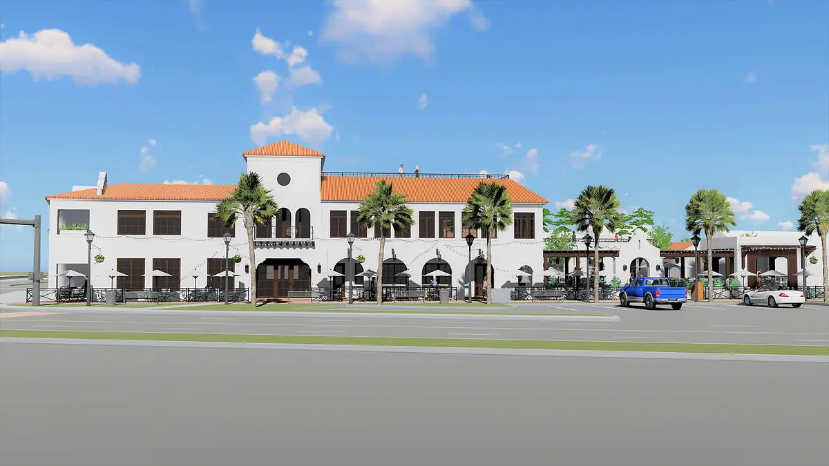 Exterior view of a two-story building with tiled roof, arched windows, and palm trees.
