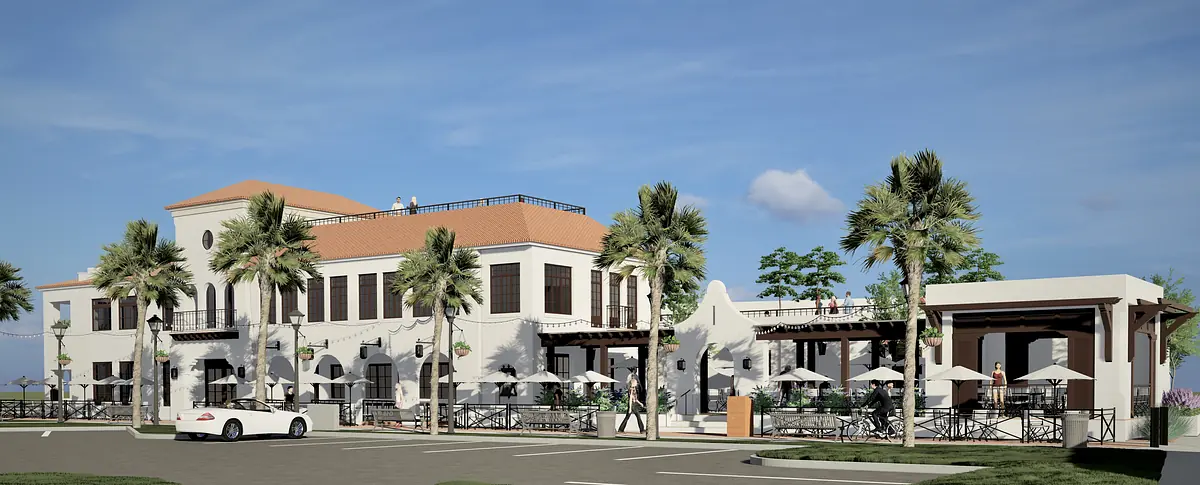 Exterior front view of a two-story building with red tile roof, palm trees, and patio area with tables and umbrellas.