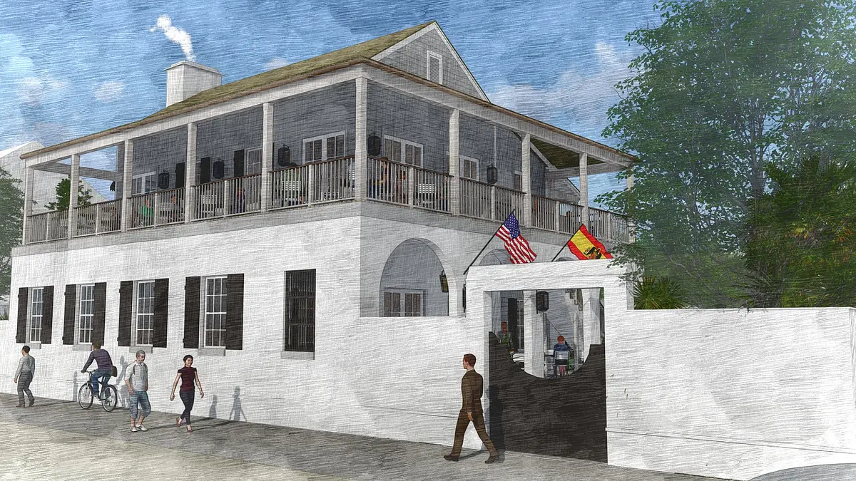 Exterior front view of a two-story building with balcony, porch, flags, and people walking and biking.