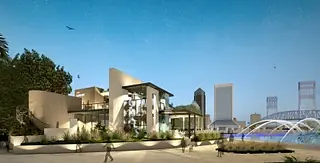 Modern building exterior with large windows, textured surfaces, landscaping, and water features.