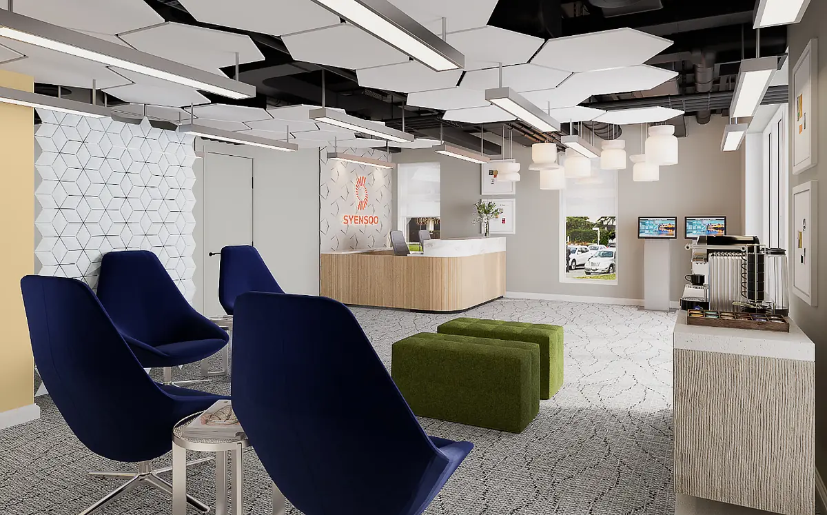 Office space with blue armchairs, green ottomans, reception desk, patterned carpet, and unique ceiling design