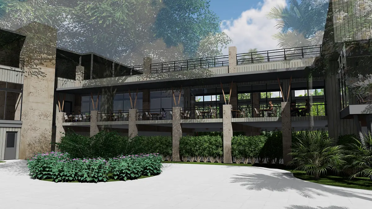 Exterior front view of a multi-level building with balcony, concrete pillars, and surrounding greenery.