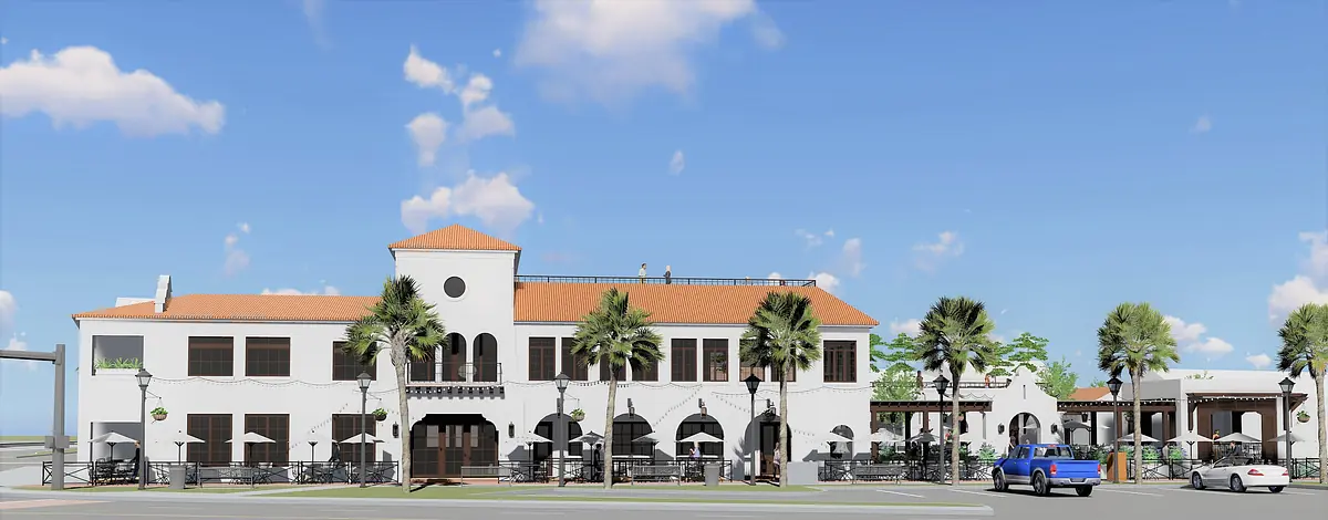 Exterior view of a building with white facade, tile roof, palm trees, and outdoor seating areas.