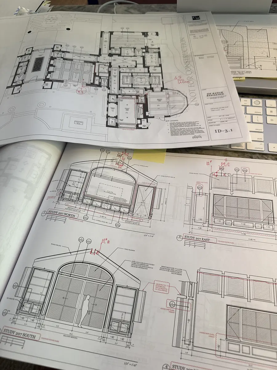 Architectural plans showing floor layouts and elevation drawings with annotations and measurements.
