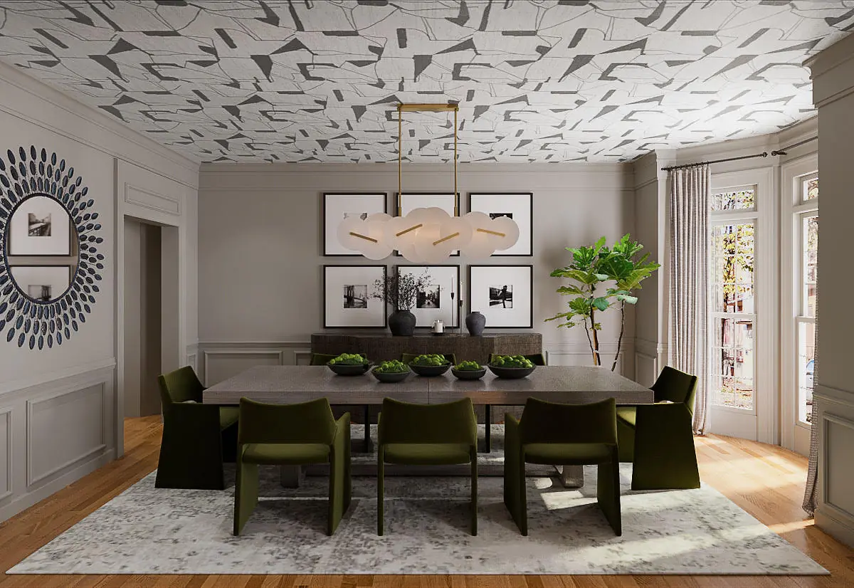 Dining room with large table, dark green chairs, plants, framed artwork, and large windows for natural light