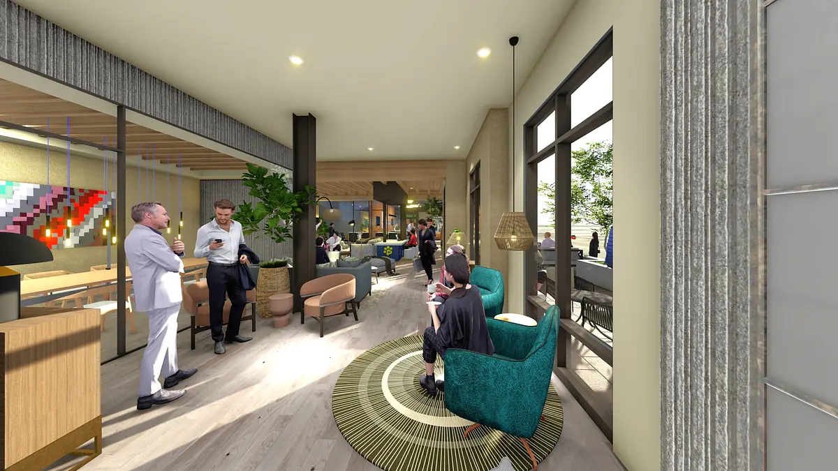 Living room area with turquoise chairs, circular rug, wooden coffee table, plants, and large windows.